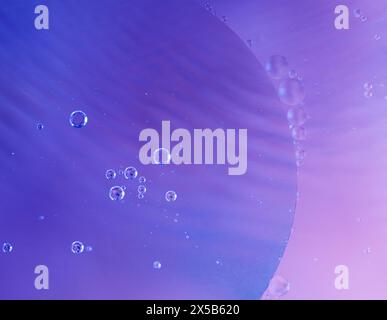 Colorful abstract macro background with oil drops in water Stock Photo