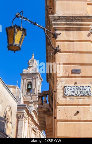 Mdina, Malta - August 22, 2019: Street light mounted on the wall of St.Pauls square of Mdina, fortified old city of Malta Stock Photo