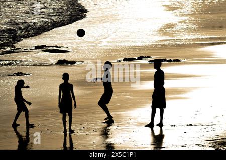 Salvador, Bahia, Brazil - February 14, 2019: Young people are seen having fun and playing beach soccer in the late afternoon in the city of Salvador, Stock Photo