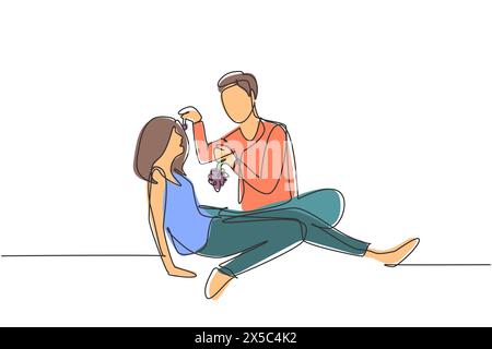 Continuous one line drawing romantic couple having picnic in summer park. Relaxing together sitting on the ground and men feeding grapes to women. Sin Stock Vector