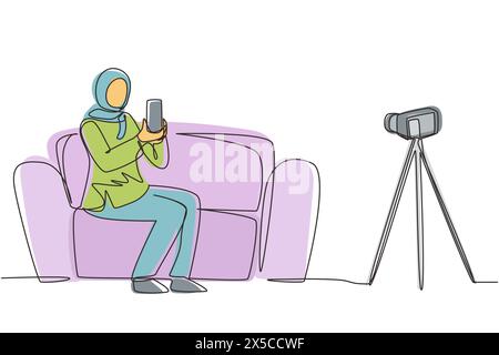 Continuous one line drawing Arab female influencer filming video review smartphone on dslr camera at home. Blogger advertising tech product, streaming Stock Vector