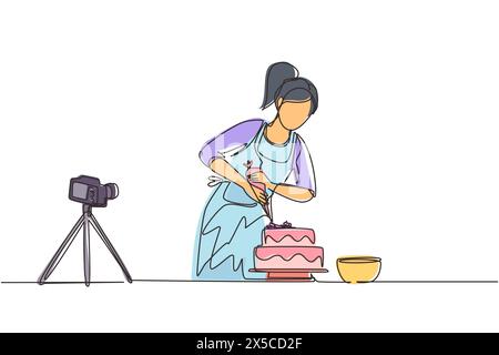 Single continuous line drawing girl baking and decorating cake at kitchen. Woman blogger recording video on camera, using tripod, posting it on social Stock Vector