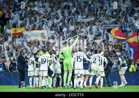 Madrid, Spain. 8th May, 2024. Real Madrid's players celebrate after winning the UEFA Champions League semifinal second leg match between Real Madrid and Bayern Munich at Santiago Bernabeu stadium, in Madrid, Spain, on May 8, 2024. Credit: Gustavo Valiente/Xinhua/Alamy Live News Stock Photo