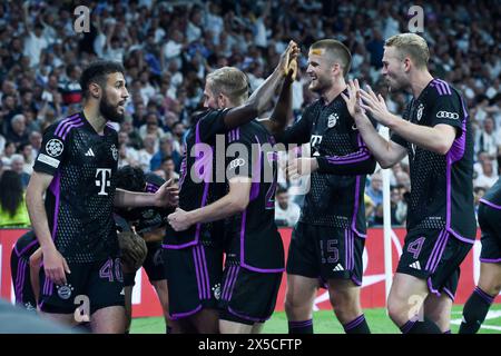 Madrid, Spain. 8th May, 2024. Players of Bayern Munich celebrate scoring during the UEFA Champions League semifinal second leg match between Real Madrid and Bayern Munich at Santiago Bernabeu stadium, in Madrid, Spain, on May 8, 2024. Credit: Gustavo Valiente/Xinhua/Alamy Live News Stock Photo