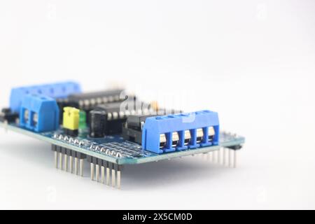 servo driver module shield that enables servo motor and stepper motors to be connected to the microcontroller isolated on a white background Stock Photo