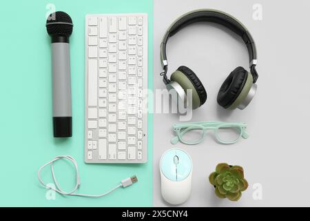 Set of modern gadgets with glasses on color background Stock Photo