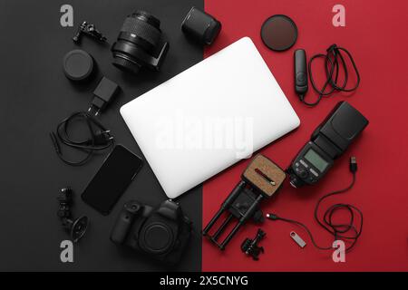 Composition with different gadgets and modern laptop on dark background Stock Photo