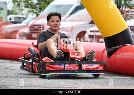 South Holland, United States. 04th May, 2024. Children participate in go-kart fun at the Cinco de Mayo event in South Holland, Illinois. Cinco de Mayo in Thornton Township is a festive celebration of community and culture. With a colorful array of activities like mariachi music, dance, and family fun, the event was more than just a party. The event was a gathering of unity and kept the community informed. Hundreds of residents attended the special occasion. Credit: SOPA Images Limited/Alamy Live News Stock Photo