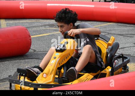 South Holland, United States. 04th May, 2024. Children participate in go-kart fun at the Cinco de Mayo event in South Holland, Illinois. Cinco de Mayo in Thornton Township is a festive celebration of community and culture. With a colorful array of activities like mariachi music, dance, and family fun, the event was more than just a party. The event was a gathering of unity and kept the community informed. Hundreds of residents attended the special occasion. Credit: SOPA Images Limited/Alamy Live News Stock Photo