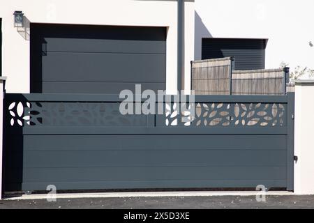 portal slide aluminum sliding grey metal gate high of modern gray suburb house entrance Stock Photo