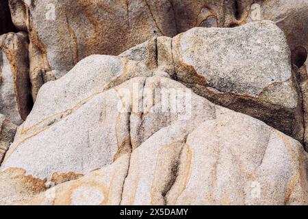 Close up sea rocks, light brown beige texture, amazing real nature forms holes color stains Stock Photo
