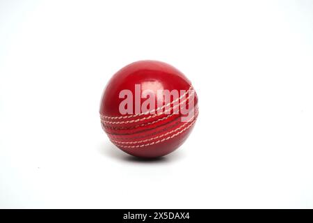 red cricket leather ball isolated Stock Photo