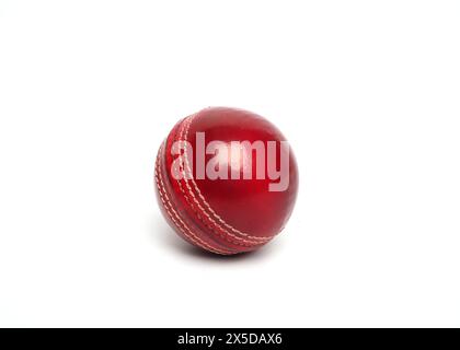 red cricket leather ball isolated Stock Photo