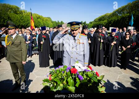 Berlin, Germany. 09th May, 2024. A visitor in uniform salutes a memorial wreath at the Soviet War Memorial in Treptower Park. May 8 and 9 marks the 79th anniversary of the liberation from National Socialism. Credit: Christoph Soeder/dpa/Alamy Live News Stock Photo