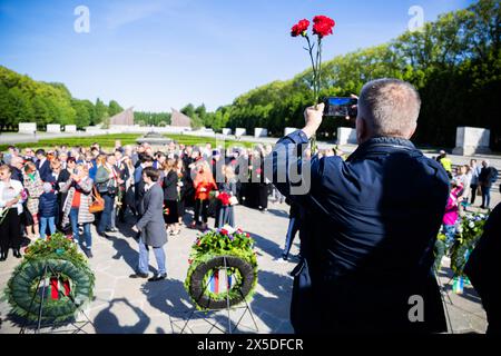 Berlin, Germany. 09th May, 2024. A visitor takes a photo at the Soviet memorial in Treptower Park. May 8 and 9 marks the 79th anniversary of the liberation from National Socialism. Credit: Christoph Soeder/dpa/Alamy Live News Stock Photo