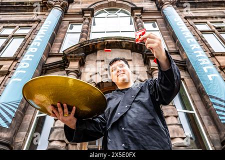 Edinburgh, United Kingdom. 09 May, 2024 Pictured: Performance maker, poet and self-confessed foodie, Sean Wai Keung, who’s show A History of Fortune Cookies will be playing at the Summerhall Festival as part of the Edinburgh Fringe, successfully predicts the shows that will form the festival in August by using his own Fortune Cookies. Credit: Rich Dyson/Alamy Live News Stock Photo