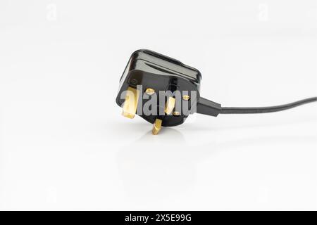UK standard AC line plug isolated on white background Stock Photo
