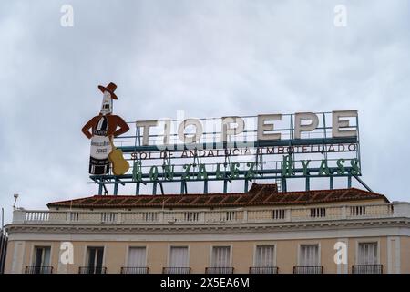 Madrid, Spain. February 11, 2024 - Tio Pepe neon sign on a roof at the square Puerta Del Sol Stock Photo