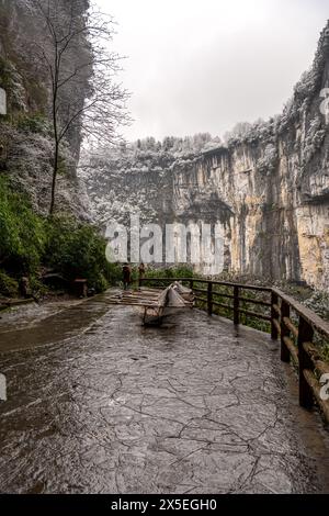 A snowy day at the Three natural bridges scenic spot in Chongqing, China. Cloudy sky with copy space for text Stock Photo