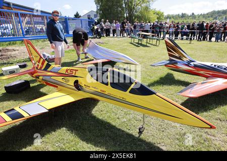 Ballenstedt, Germany. 09th May, 2024. Model airplane pilots bring their jet-powered aircraft models into take-off position. The airfield hosted an open day on Ascension Day. Thousands of visitors experienced flight demonstrations and parachute jumps by participating pilots throughout the day. Credit: Matthias Bein/dpa/ZB/dpa/Alamy Live News Stock Photo