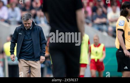 Cologne, Germany. 09th May, 2024. Soccer, Women: DFB Cup, VfL Wolfsburg - Bayern Munich, final, RheinEnergieStadion. Bayern coach Alexander Straus stands on the sidelines. Credit: Fabian Strauch/dpa - IMPORTANT NOTE: In accordance with the regulations of the DFL German Football League and the DFB German Football Association, it is prohibited to utilize or have utilized photographs taken in the stadium and/or of the match in the form of sequential images and/or video-like photo series./dpa/Alamy Live News Stock Photo