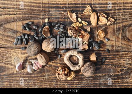 Composition with walnuts and seeds on wooden background, top view Stock Photo