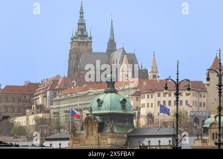 prague, czech republic - Mar 3 2024: City centre with historical buildings and church. Czech and EU flag visible Stock Photo