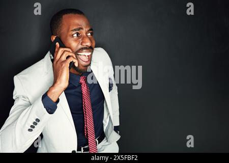 Black man, lawyer and shocked with phone call in studio on dark background with court case for client. Mockup, business and surprised with Stock Photo