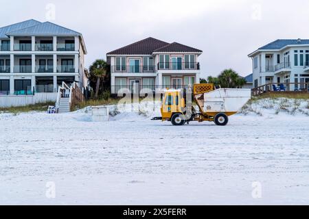 Specialized garbage truck picking up trash cans or garbage cans on the beach in Destin Florida, USA. Stock Photo