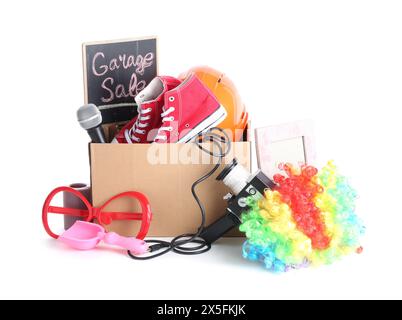 Box of unwanted stuff isolated on white. Garage sale Stock Photo