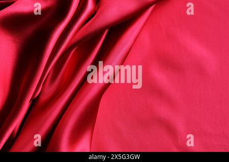 Ripples in red silk fabric Stock Photo