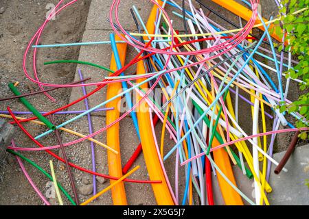 Remains of empty conduits for fiber optic cables that have been laid, in which the actual fiber optic cable is later blown in and connected to the res Stock Photo