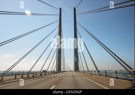 Steel wires from the pylons on the Øresund Bridge form a pattern across the roadway between Malmö and Copenhagen Stock Photo