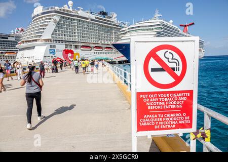 Cozumel Mexico,Cruise Port Pier,Norwegian Joy Cruise Line ship,7-day Caribbean Sea itinerary,Carnival Glory docked,sign notice warning,Spanish English Stock Photo