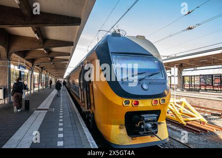 Picture of a train of Dutch railways ready for departure. Maastricht railway station is located in Maastricht in Limburg, Netherlands. It is the main Stock Photo