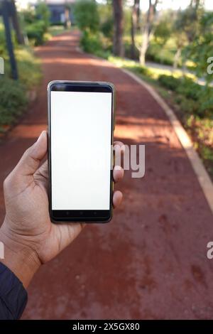 pov shot of young man using smart phone at outdoor  Stock Photo
