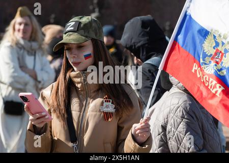 St. Petersburg, Russia. 09th May, 2024. A girl with the 'Z' symbol holds the Russian flag during the celebration of Victory Day, dedicated to the 79th anniversary of the victory over Nazi Germany in World War II. (Photo by Andrei Bok/SOPA Images/Sipa USA) Credit: Sipa USA/Alamy Live News Stock Photo