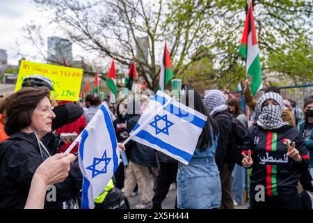 Toronto, Canada. 08th May, 2024. Pro-Israel supporters hold Israeli flags during the demonstration. Pro-Palestinian and Pro-Israel protesters at the University of Toronto outside student encampment occupying King College Circle. Advocating for Palestinian rights, students and faculty displayed banners depicting the plight of Palestinians, anti-Zionist and anti-Israel messages, while pro-Israel protests involved students and supporters in waving Israeli flags, and engaging in dialogues to defend Israel's actions and policies. Credit: SOPA Images Limited/Alamy Live News Stock Photo