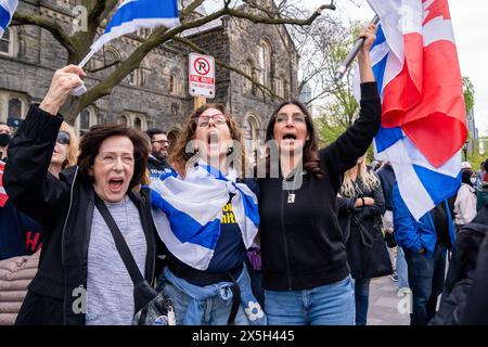 Toronto, Canada. 08th May, 2024. Pro-Israel supporters hold flags during the demonstration. Pro-Palestinian and Pro-Israel protesters at the University of Toronto outside student encampment occupying King College Circle. Advocating for Palestinian rights, students and faculty displayed banners depicting the plight of Palestinians, anti-Zionist and anti-Israel messages, while pro-Israel protests involved students and supporters in waving Israeli flags, and engaging in dialogues to defend Israel's actions and policies. Credit: SOPA Images Limited/Alamy Live News Stock Photo