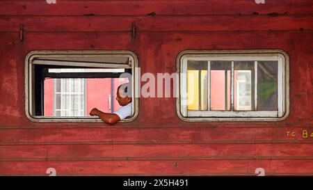 Man Sitting in old Train of Sri Lanka, Colombo, Sri Lanka. Stock Photo