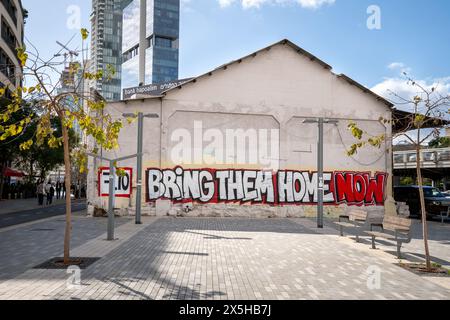 Tel Aviv, Israel - March 15, 2024. Bring Them Home graffiti on the wall Stock Photo