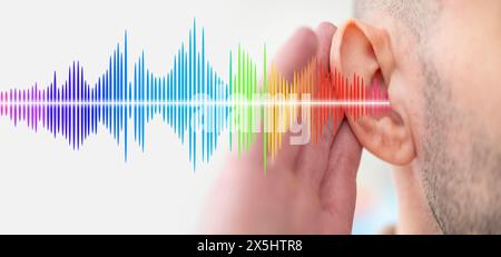 young man ear closeup listening, sound wave, acoustics Auditory System, Hearing Test, Cochlear implant, Assistive listening device Stock Photo