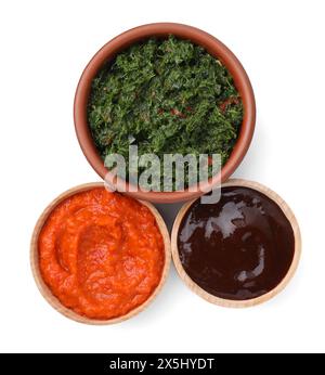 Different fresh marinades in bowls isolated on white, top view Stock Photo