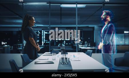 Futuristic Office Online Meeting Video Conference Call: Businesswoman and Businessman Talk using Augmented Reality Metaverse. Global e-Business For Virtual Remote Work. Hologram Concept Simulation Stock Photo