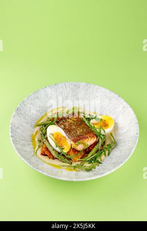 fried fish in a side dish on a plate Stock Photo
