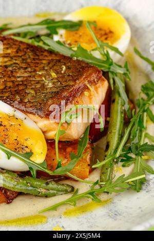 fried fish in a side dish on a plate Stock Photo