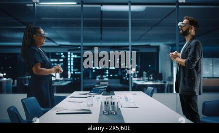 Office Online Meeting Video Conference Call: Businesswoman and Businessman Wearing Virtual Reality Glasses Talk using Augmented Reality Metaverse. Ultra Realistic Hologram of Employee Concept. Stock Photo