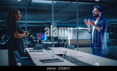 Futuristic Office Online Meeting Video Conference Call: Businesswoman and Businessman Talk using Augmented Reality Metaverse. Global Business For Virtual Remote Work. Hologram Simulation. Stock Photo