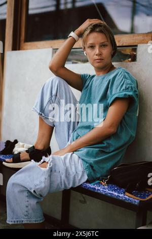 Emotional character portrait, young stylish woman in a cap, close-up. Stock Photo
