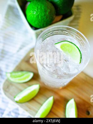 Close-up of iced water with fresh cut limes Stock Photo